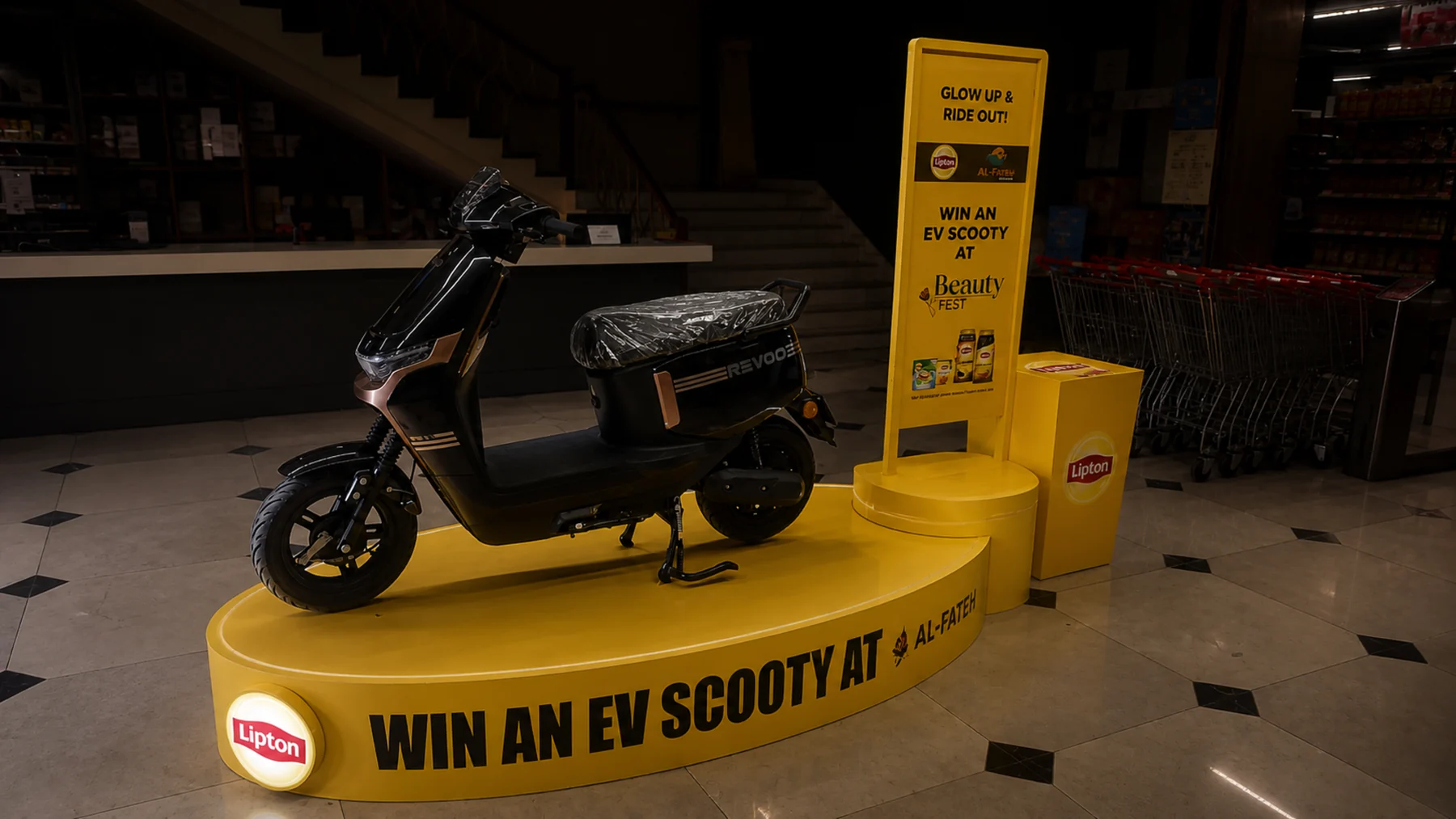 Lipton EV scooty podium sited at a mall entrance