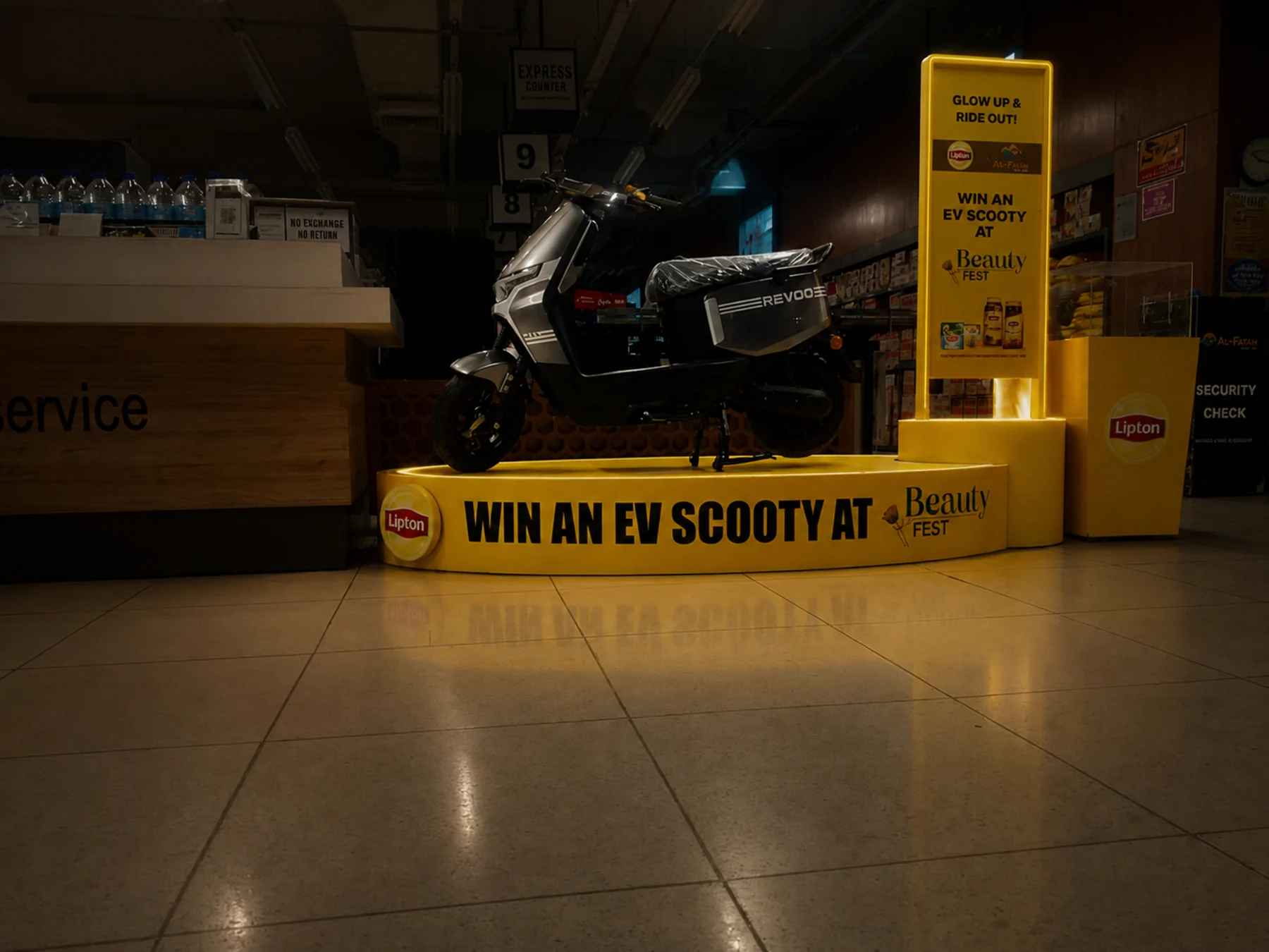 Lipton EV scooty podium at a store service area