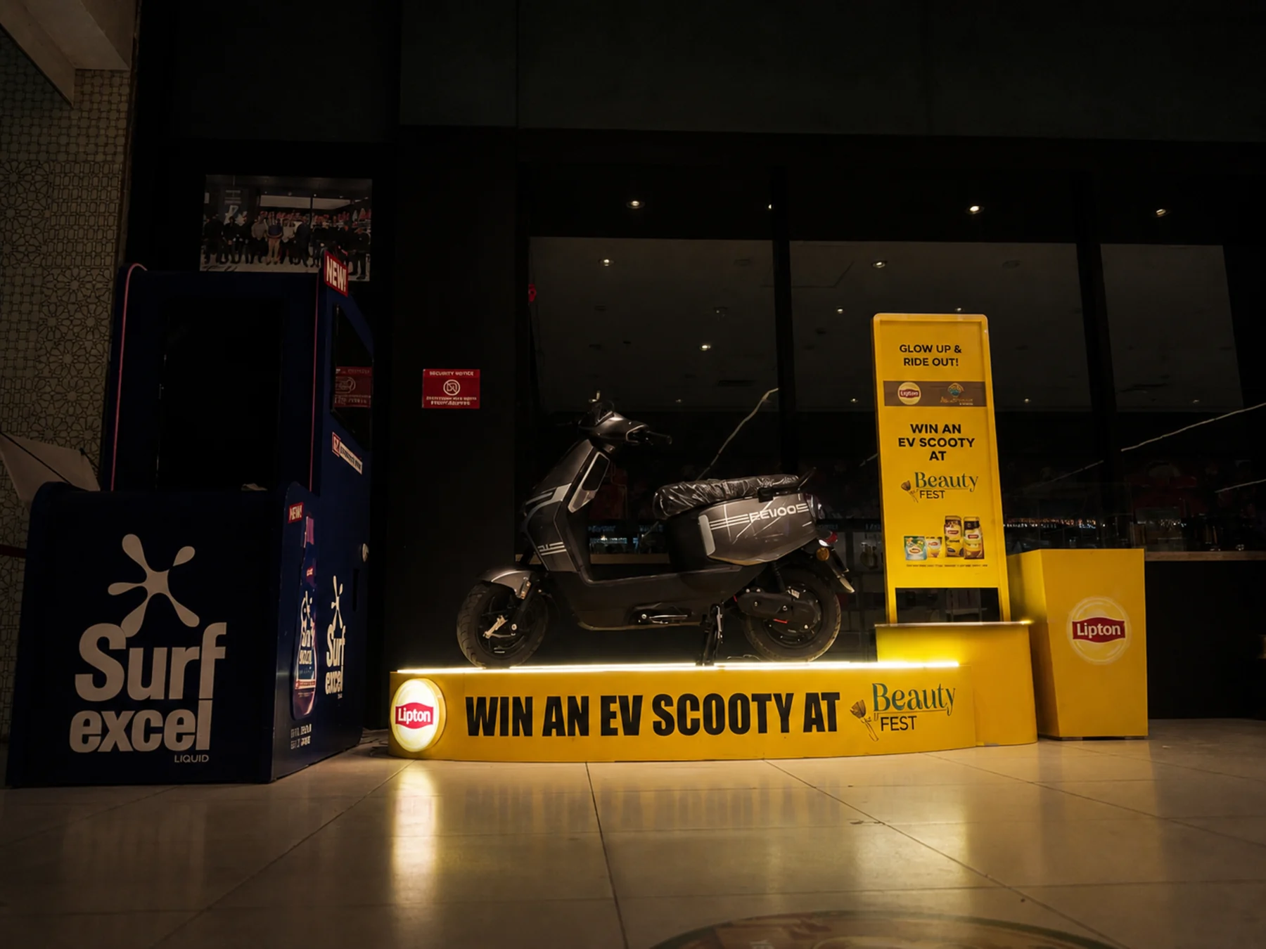 The EV scooty podium under evening store lighting