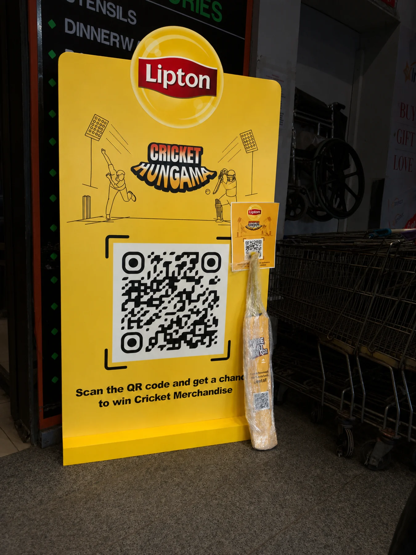 Lipton PSL standee with the branded cricket bat leaning against it