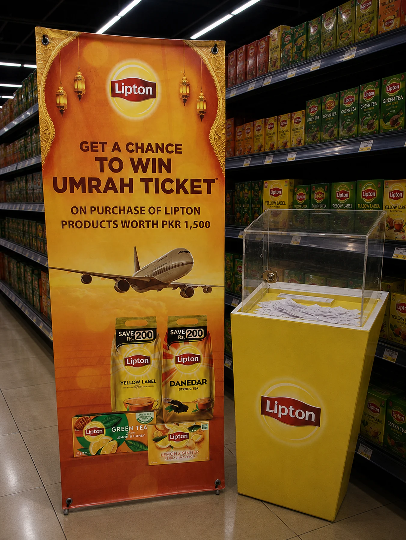 Lipton Umrah standee and drop box in a Carrefour aisle at Packages Mall