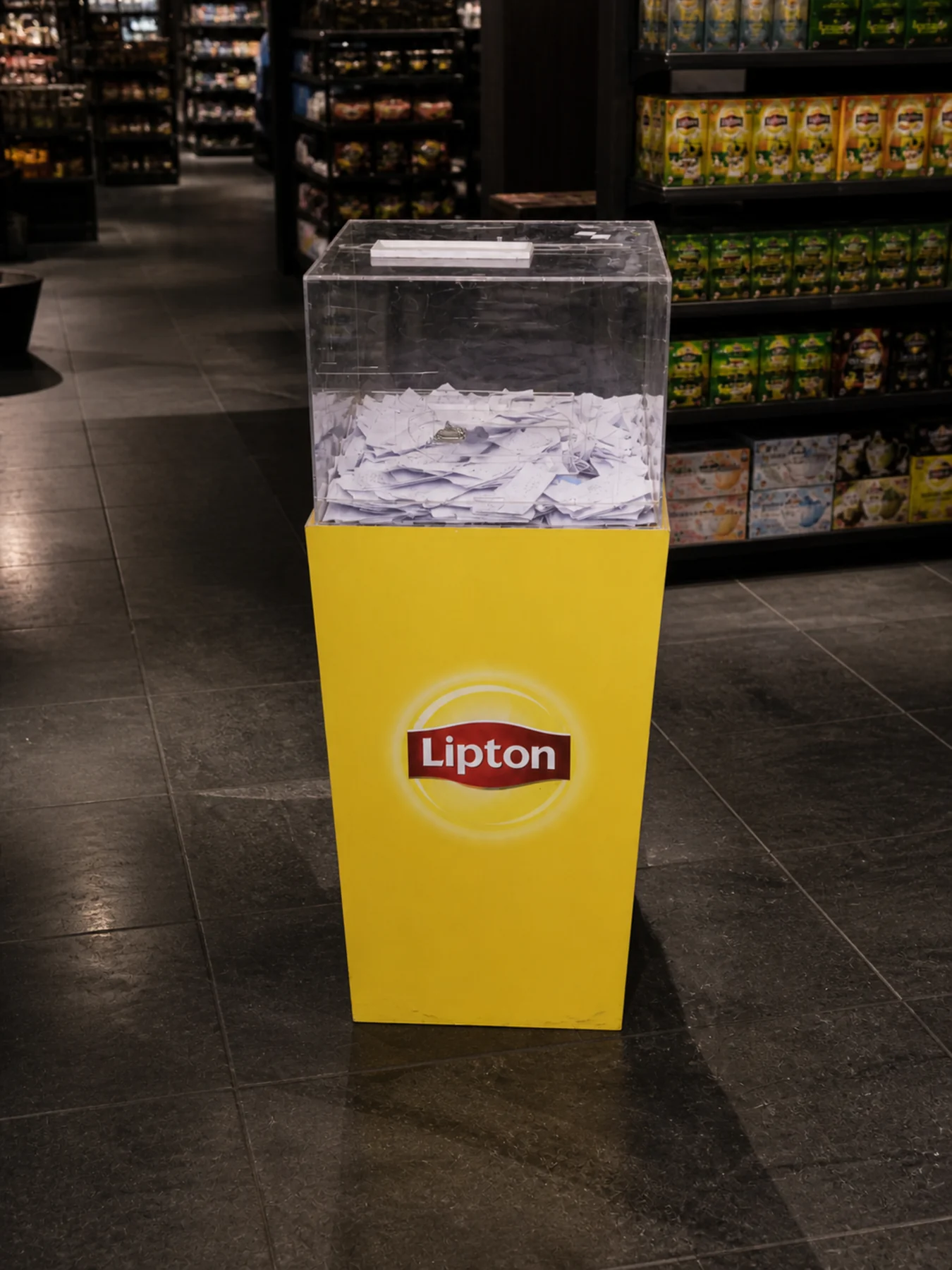 Lipton drop box positioned at the store exit at Imtiaz Multan