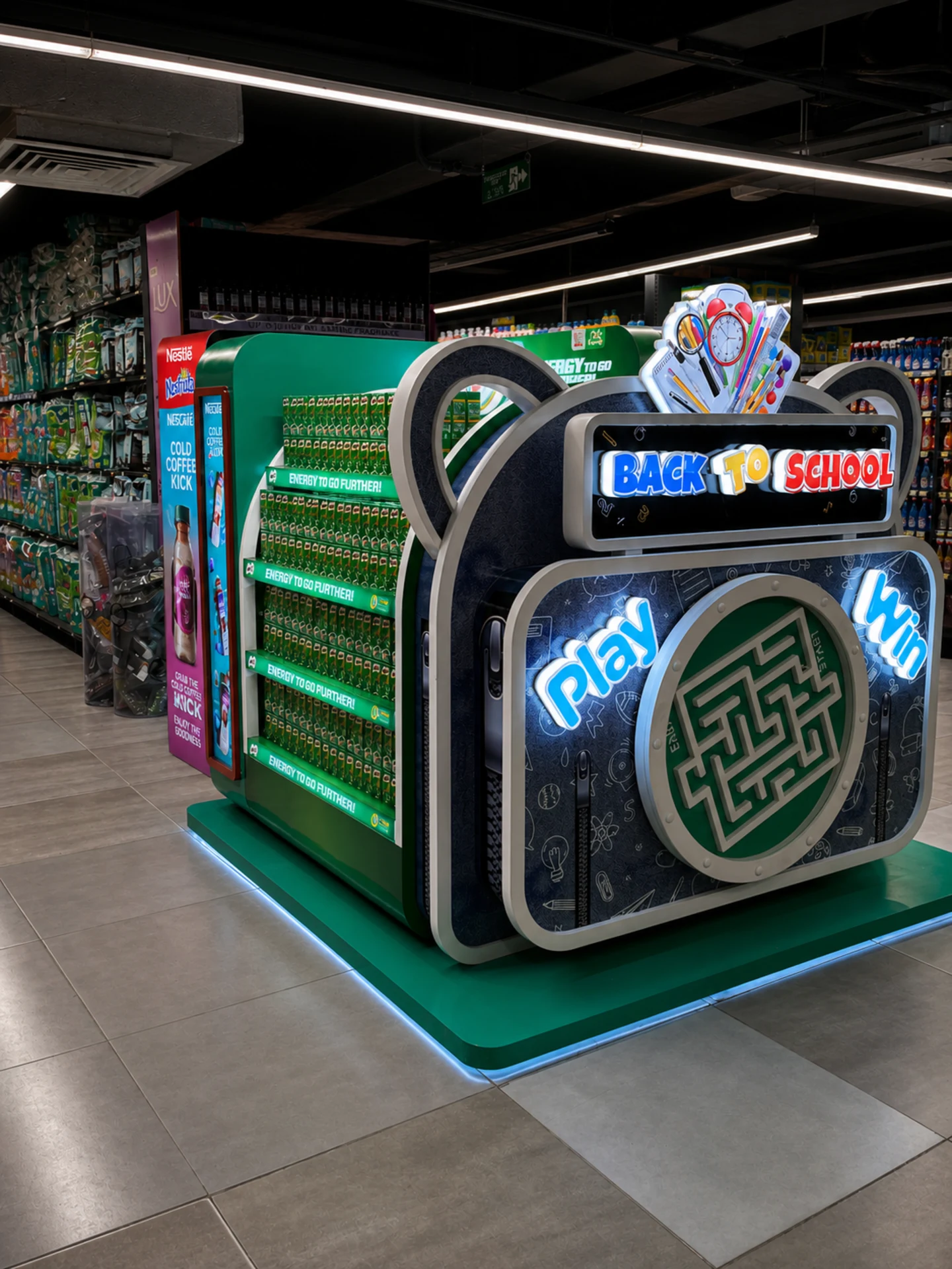 Angled view of the illuminated Back to School campaign face beside the Milo zone