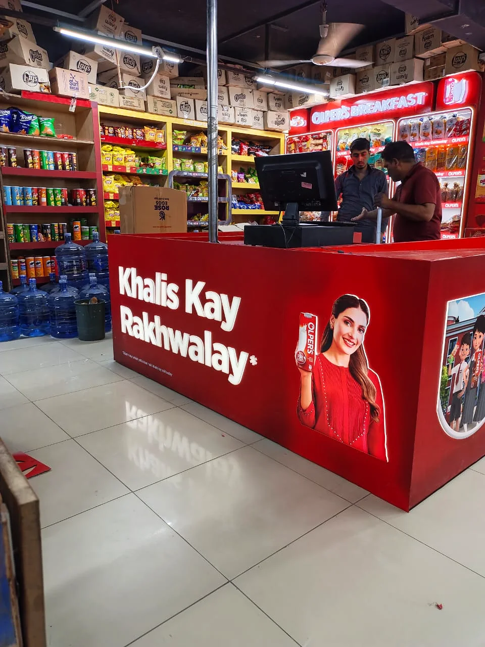 Olper's-wrapped checkout counter at Save Mart G6, main face
