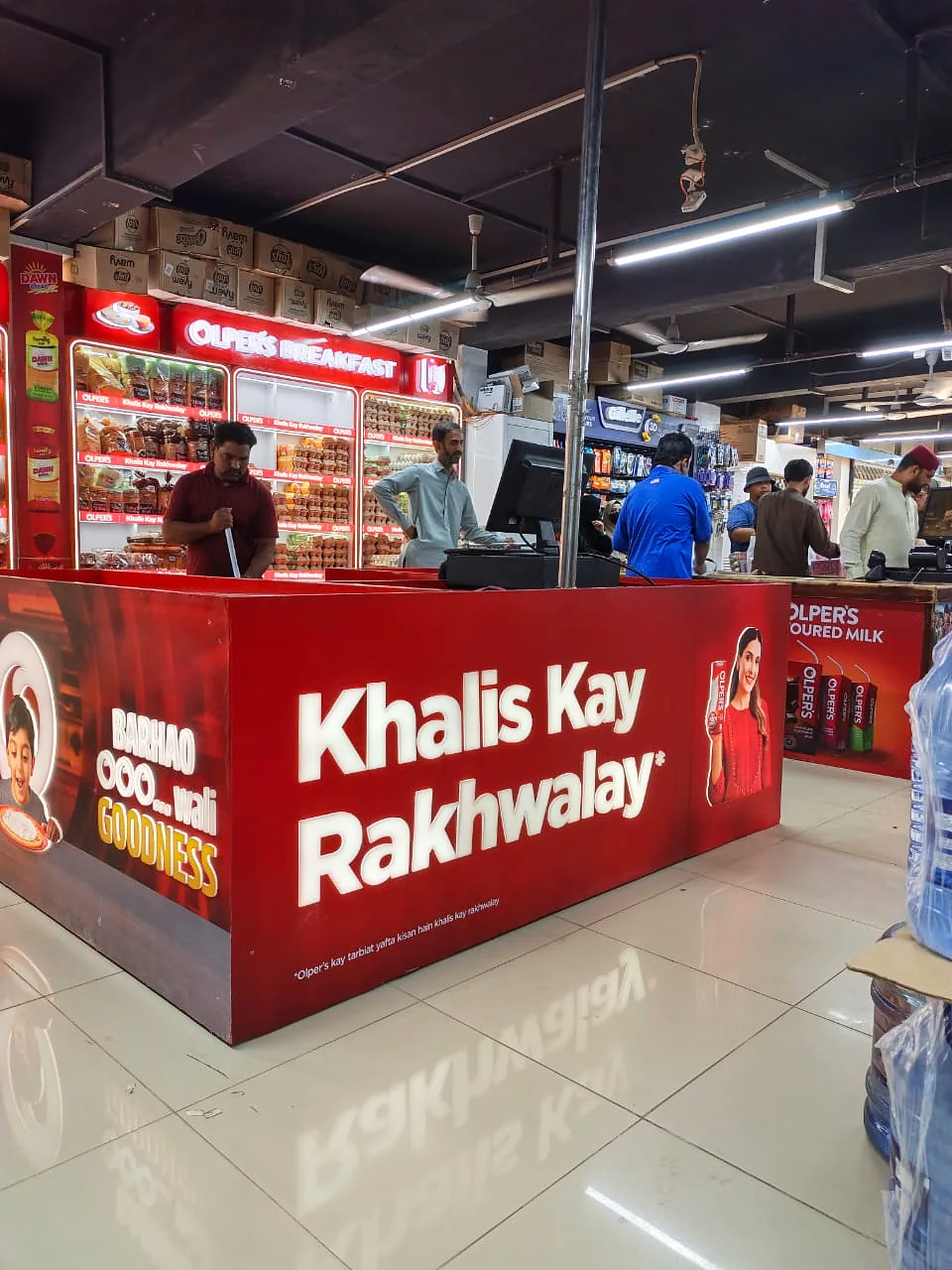 Wide view of the wrapped Olper's checkout counter in the store