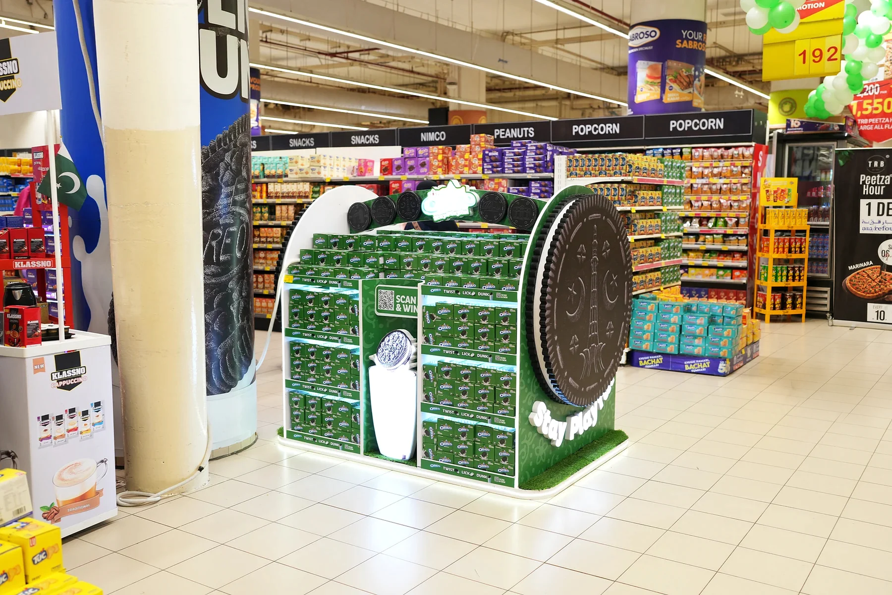 Oreo cookie-shaped unit seen in its aisle context beside the biscuit category