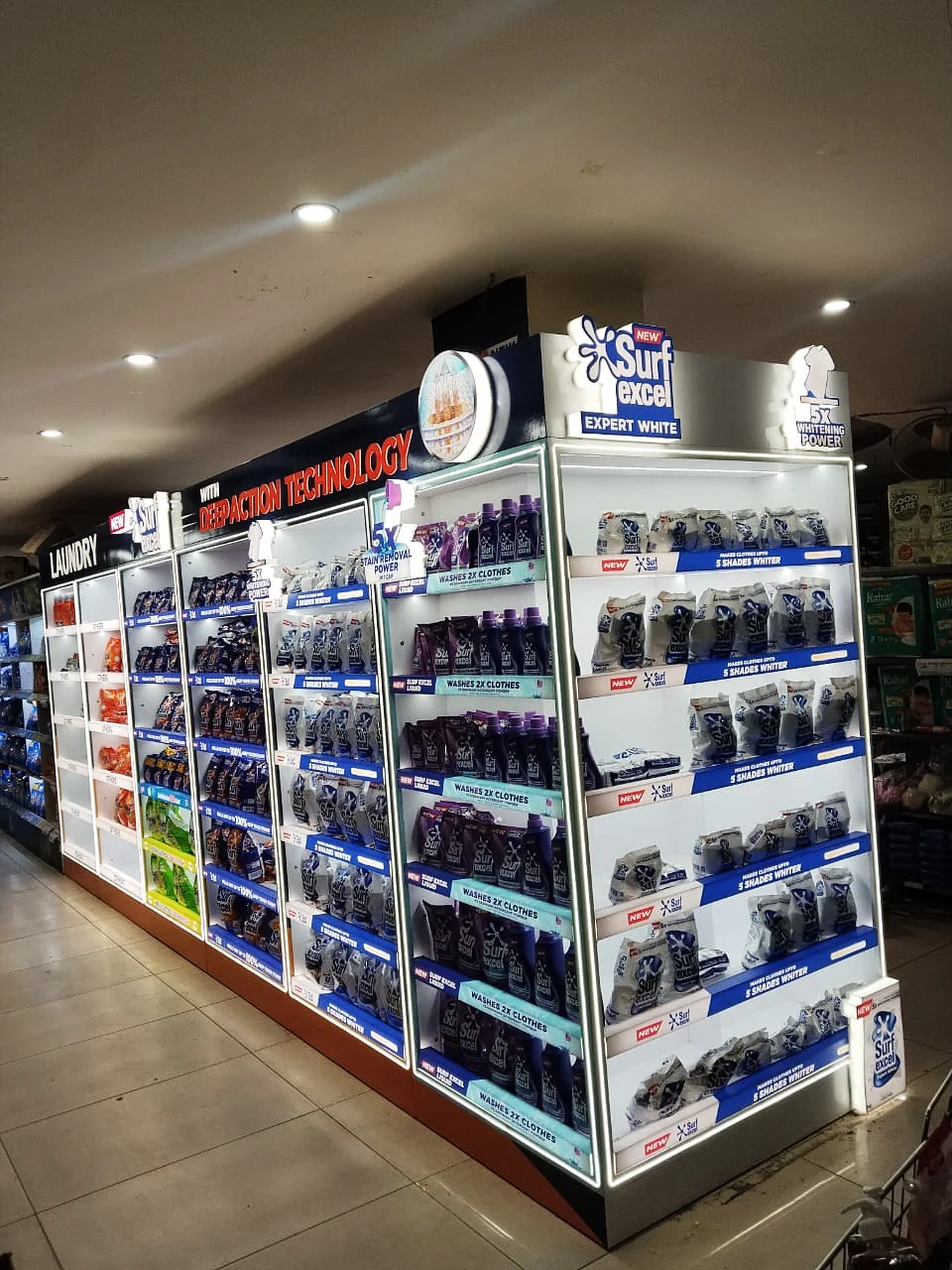 Long illuminated laundry category run with lit shelf edges