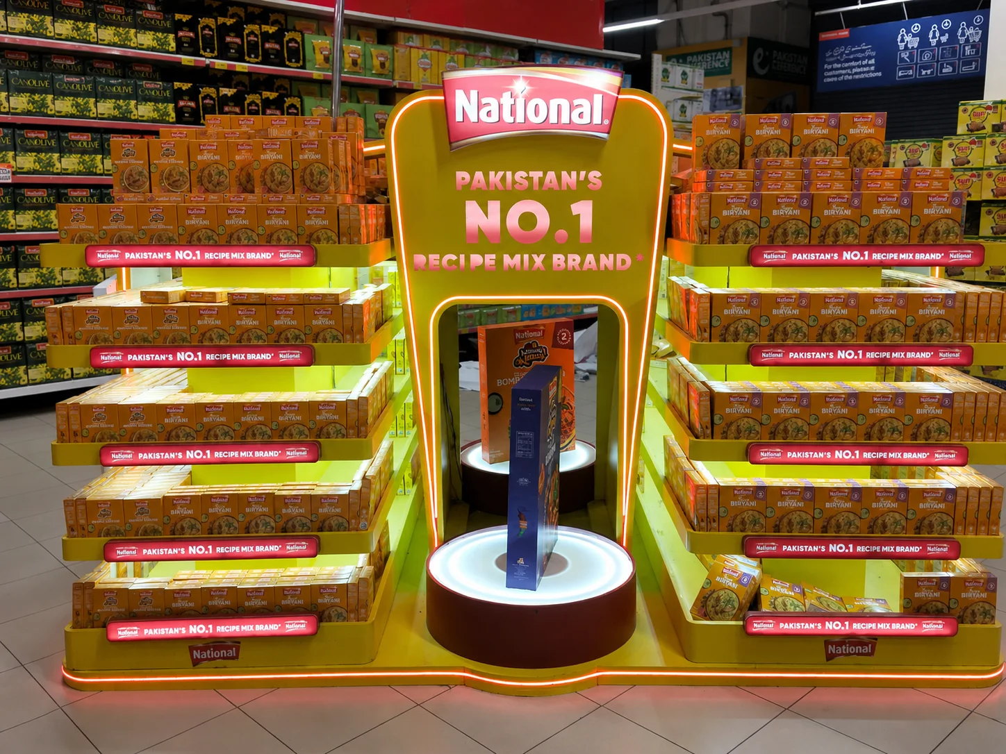 National Foods yellow retail podium