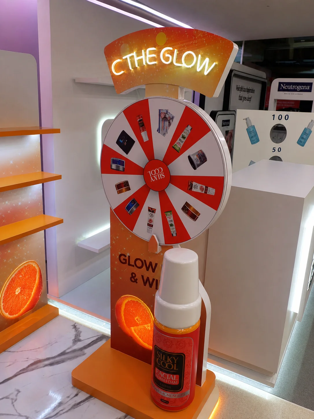 Interactive orange retail counter with prize wheel